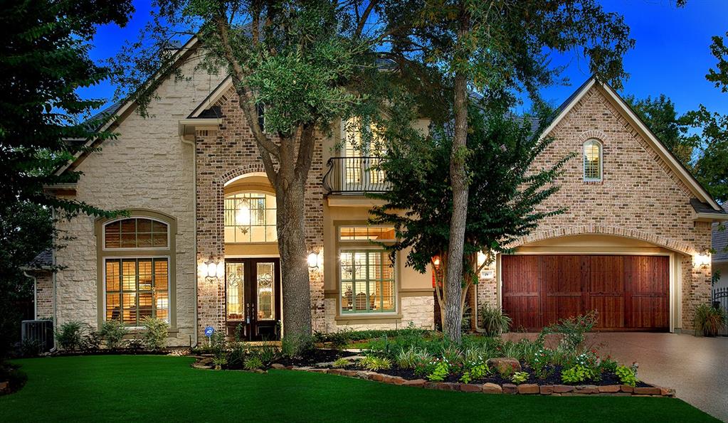26 Stanwick Place The Woodlands, Texas Gorgeous Meadowlark custom home on a cul-de-sac street in Sterling Ridge! Zoned to exemplary schools and close to shops, fine dining, parks with tennis courts, hike and bike trails. Four car attached garage ensures plenty of parking! Plantation shutters, crown moulding, extensive tile floors, abundant windows, detailed trim work and plenty of storage throughout. Island kitchen with stainless steel appliances, walk-in pantry, breakfast bar and granite counters opens to the breakfast room and den with gas log fireplace; wine grotto; formal dining with chair rail; wood paneled study with built-in desk and French doors; owner's retreat and 2nd bedroom down; 3 bedrooms, flex room, media with kitchenette and game room up; private, fenced yard with covered patio, heated pool with waterfalls and spa surrounded by mature trees.