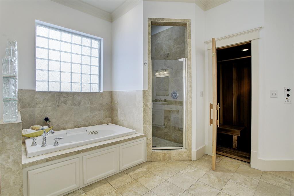 This room of course also has light as well as privacy with its oversized glass block window.  The spa like space includes a separate shower stall and tub.