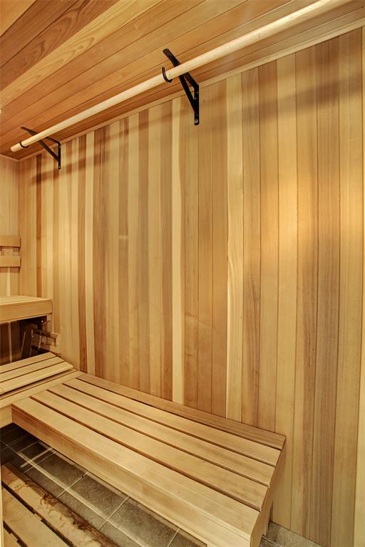 The dry sauna has an L shaped seating configuration, and can double as another closet (outfitted with a clothes hanging bar).