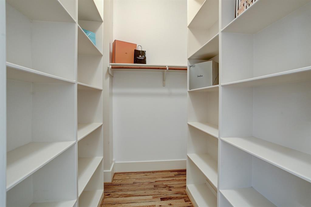 This closet is one of two in the first floor primary bedroom, located between the bath and bedroom.  There is another traditional closet across from it.