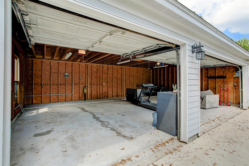 A significant portion of the attic space in the garage is decked for yet more storage.
