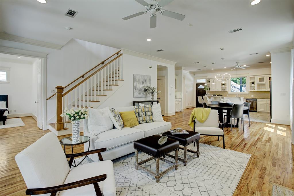 Upon entering this gracious home you'll find a wonderfully open living, dining and kitchen space.  These gorgeous hardwood floors run throughout on both levels (with the exception of tile in the kitchen, baths and laundry).