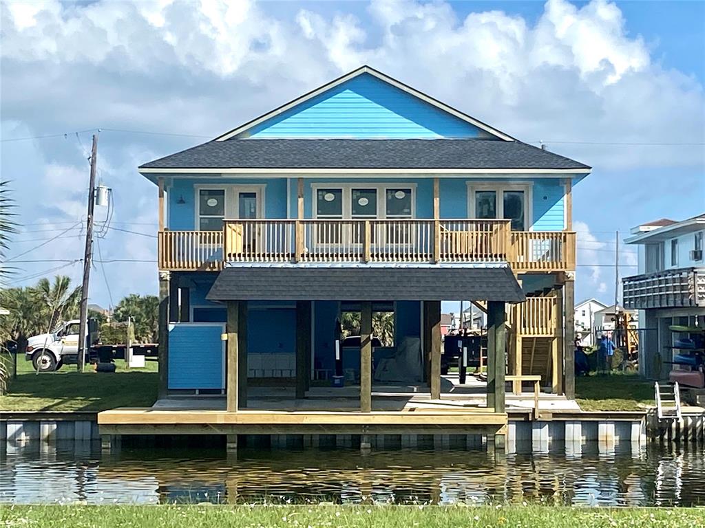 This custom home is located in the Spanish Grant Subdivision and will be ready for new owners in March of 2022. This 1741 sq ft waterfront home offers 4 bedrooms, 2.5 baths, and a 2 car garage. This home will be complete with composite boat house and party deck with easy access to West bay. Loaded with features that include large open living room with wall of windows and high ceilings, wood look tile floors, gourmet kitchen with stainless appliances, custom cabinetry, quartz or granite counters, and island. Primary bedroom has vaulted ceilings, a walk-in closet, custom walk-in shower, quartz/granite counters and double sinks. All high efficiency impact windows and doors. Home will be wired for generator for emergencies. Home is also raised well above base flood elevation for cheaper flood insurance and will have aluminum roof and concrete columns rather than wood. *Pictures are from previously built home nearby*
