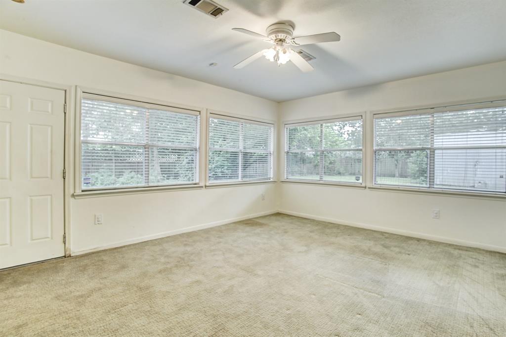 You'll spend much of your time in this peaceful den overlooking your lush green back yard. Windows abound!