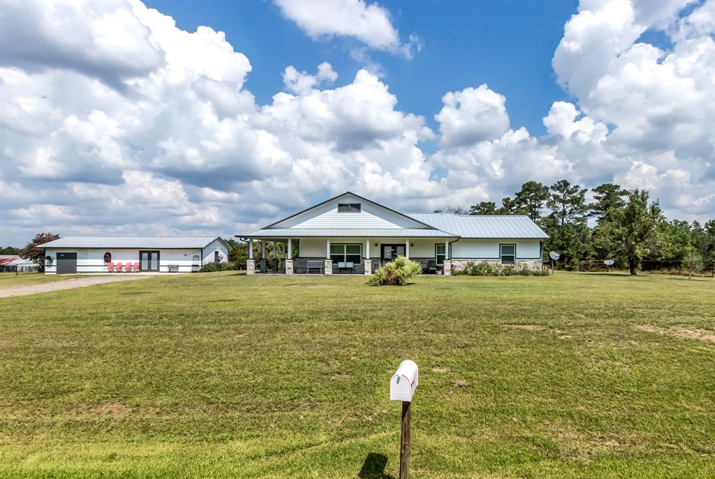 4516 County Road 245 Navasota, Texas Check out this beautiful 3 bedroom, 2 bath country home in the desired Anderson-Shiro school district! Enjoy quiet county living with quick access to HWY 105 and the new 249 Tollway. The home was brought down to the slab in 2018 and completely reconstructed with additional square footage added. This home features an inviting open floor plan with wood tile flooring, quartz countertops, large island, stone fireplace and custom cabinets & built ins throughout. The master suite is stunning with his and her closets, oversized walk-in shower, quartz countertops and separate vanities. New PEX plumbing, electrical, spray foam insulation, standing seam metal roof, water well, and aerobic septic were also included in the remodel. Outside you'll find a completely tiled wrapped porch to enjoy the view! The detached building features a 20' x 35' bonus space with a half bath, kitchenette and attached storage room. The property also has a fenced pasture area and small pond.