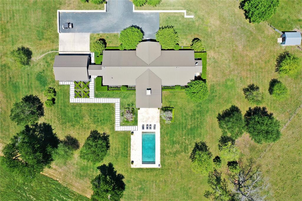 2020 Wiesepape Road Brenham, Texas Stunning 4 bedroom, 3.5 bath Ranch on over 100 acres located just outside of Brenham! This impeccably done one story ranch style home was completed by the finest in their craft such as Dungan Miller on stained concrete. Fixtures and plumbing brands like Newport Brass, Chicago, along with Rocky Mountain hardware. Upgrades include state of the art appliances, high quality fixtures and finishes. Attachment included for more details. This open floorplan is ideal for gatherings and entertaining indoors when not enjoying the pool with Oklahoma stone on surround & porches. This incredible home sits at over 300 ft. elevation with incredible views of evening sunsets, along with two ponds & views that will take your breath away. This ranch has been operating as a working cattle ranch along with horse facilities. Please no driving onto property without contacting listing agent or your agent to set up appointment for a private viewing. Houston approx. 1hr. Austin 1.5, College Station 30 min.