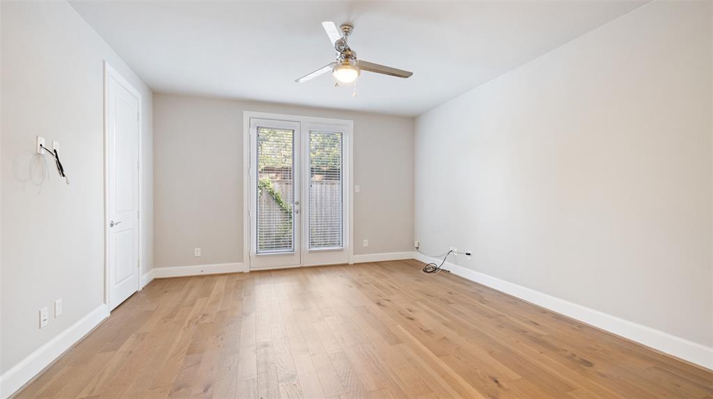 This large bedroom downstairs provides a flexible space that can serve as a secondary bedroom, study/office space, or workout room. This bedroom is large and offers immediate access to the backyard. Per the seller, this home also includes whole home wired networking.