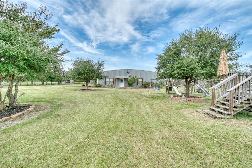 2266 Dutton Lane Madisonville, Texas 3 bed 2 1/2 bath Barndominium on 30 acres in Madison County. Updates include new granite counter tops, flooring throughout the house, as well as the master bath. The entire barn is 4000 sq ft with apx. 1700 sq ft of living space. There is plenty of room for parking vehicles, tractors, trailers, etc. under the shed. Also on the property sits another barn that is being used for hay storage. Good set of cattle working pens as well as a lighted roping arena. The property consists of scatted oak trees which provides plenty of privacy from neighbors. Whether your looking for a quiet weekend in the county or a permanent residence, this is the property.
