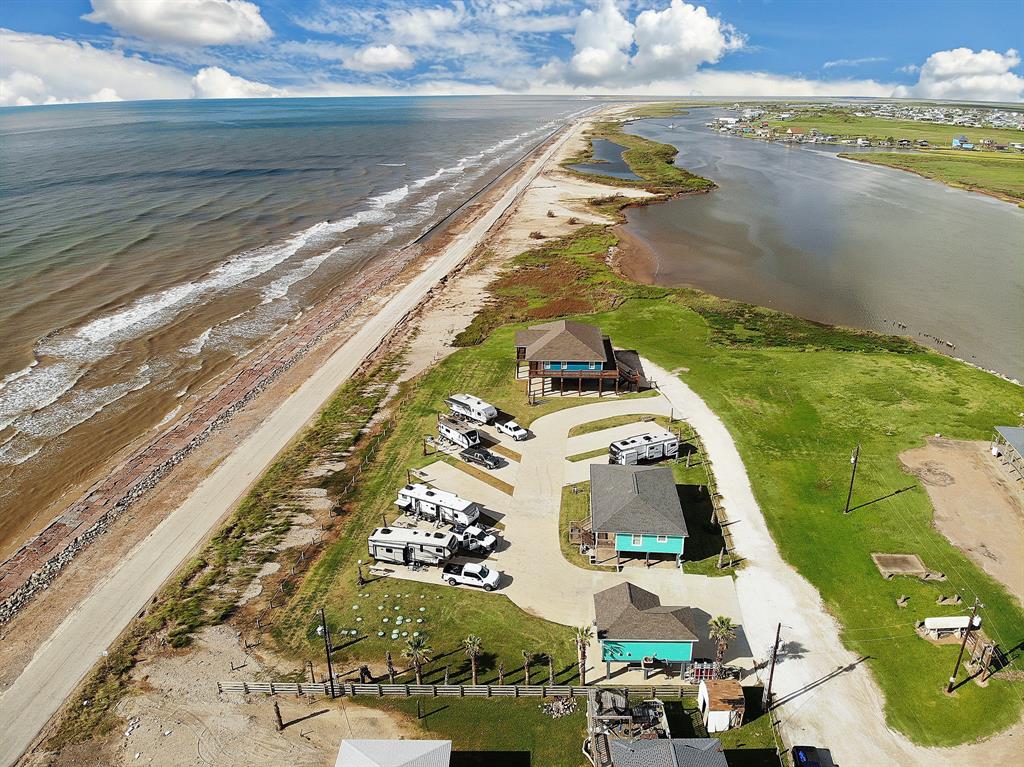 A unique opportunity on a gorgeous beachfront property with beautiful views of the ocean and the intercoastal waterway. This 1 acre paradise encompasses 2 beach houses, a 7 spot RV park, and a washateria/office building. The main house is a 1960 SF home completed in the Spring of 2021. Inside you will find custom cabinetry and trim work, triple pane windows, recessed lighting, and an open kitchen/living room with plenty of room at the bar! New HVAC system, roof, pex distribution for water, and appliances. Available fiber internet service makes working from home or having multiple streaming devices a breeze. Outside, you can relax on a hammock while listening to the waves roll in on 879 square feet of covered deck or watch the barges roll in from the back deck. Nearby activities include a public boat ramp and fishing pier 1/2 a mile away, crabbing, bird watching, surfing, enjoying nearby restaurants and much more! Please view the uploaded attachment for more details!