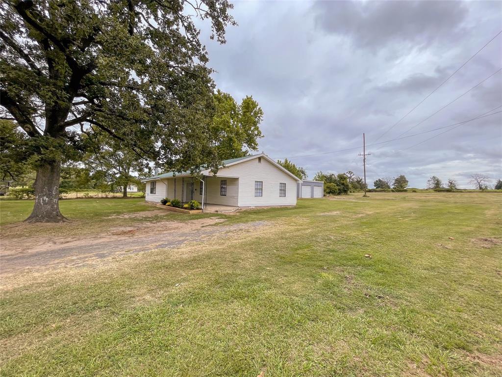 10051 County Road 329 Buffalo, Texas Country living on 3+ acres. Located just outside of town you have plenty of space to stretch out. You will love the layout of this home, Large family room with wood burning fireplace welcomes you inside. Kitchen is open to the dining and family room area, 3 bedrooms and 2 bathrooms down the hallway. Property is mostly cleared with large oak trees shading the yard. You will enjoy the 2 car detached garage and a small storage building in the back yard to store your toys. Come See this move in ready home today!
