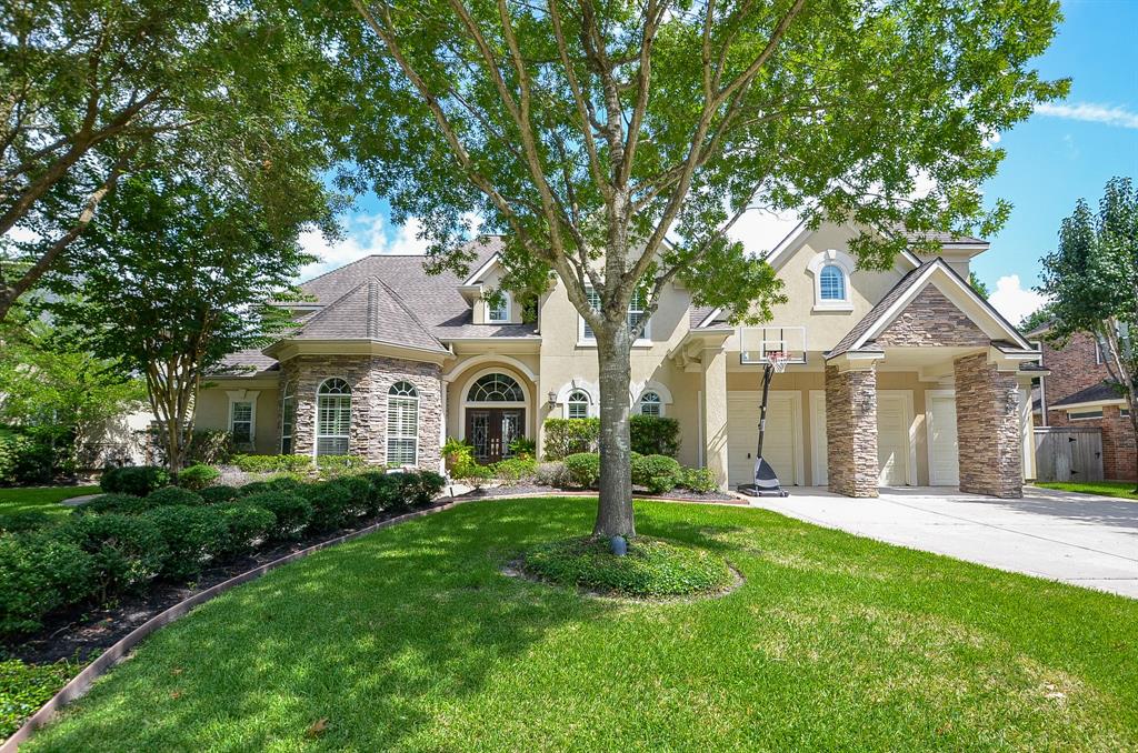 This Beautiful Stone and Stucco home is located in gated Bayou Oaks of Cinco Ranch. Pretty elevation is framed by maturing oak trees. 3 car wide garage has plenty of parking space. Interior will wow with two story foyer and family room. Recent interior painting. Abundant natural lighting floods the home. Custom millwork throughout the home provides character to the rooms. Recent paint, spacious rooms and two bedrooms down create a perfect floor plan. Open concept with island kitchen, dbl ovens and gas cooktop. Perfect for the chef in your family. Views to the beautiful pool/spa and waterfall in the private backyard. Walking distance to playgrounds. Plantation shutters through out the home. Arched windows and leaded glass double front doors are welcoming. Game, media and 3 lg bedrooms located on 2nd floor. Great storage in this home. Lovingly cared for and convenience to all things good, La Centerra, major roads, dining, shopping and great KISD schools. You will love calling this home!