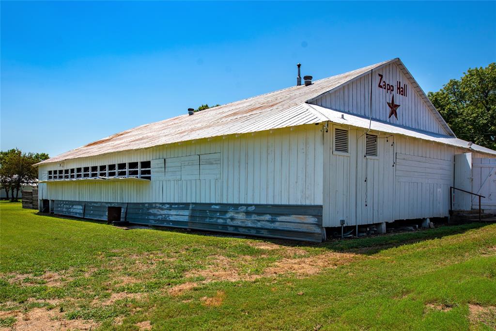 The nationally known ZAPP HALL is located in the heart and fun of the ROUND TOP/WARRENTON Antique Show. ZAPP HALL is an authentic Texas Dance Hall. Every spring and fall it transforms into a "can't miss" antique and entertainment complex. Additionally included are 7 smaller buildings currently used for restaurant facilities, where Royers Cafe at ZAPP HALL has reigned for several years, fun-filled Denverado's, a wine and beer garden and several additional antique venues. 
Sited on 3+ acres, this show brings dealers and buyers from throughout North America together in the rolling hills of Northeast Fayette County, Texas. Also used for public and private events throughout the year, the ZAPP HALL property includes a turn of the century 6 bedroom/4 bath farmhouse. Use your imagination to transform this famous property into your dream.