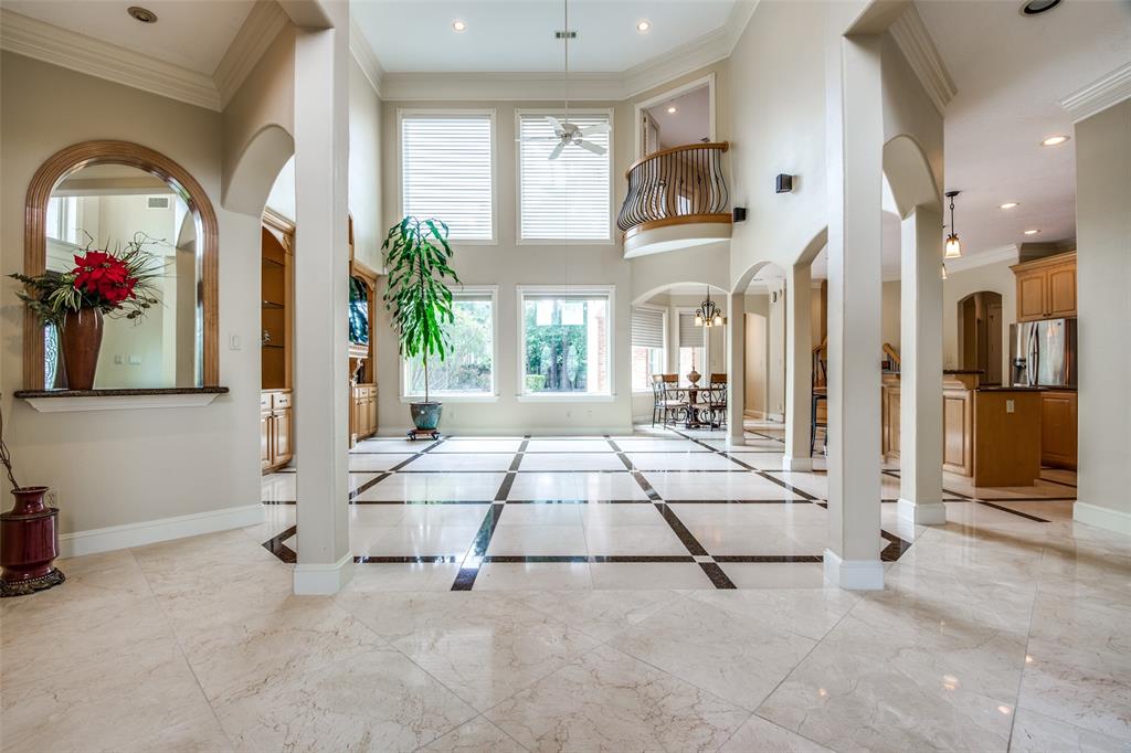 17327 N Champions Lakeway Street Tomball, Texas PRICED TO SELL NOW! Premier Custom Built Home in the multi lakes- CHAMPION LAKES ESTATES gated community. Come onto the circular driveway and grand 21 ft porch, to enter the ornamental double doors into a high ceilings grand atmosphere, connecting to the living area, granite counters kitchen on one side, living/sitting room and primary bedroom entrances on the other. Primary w/ fireplace and door to pool. Second bedroom down, w/ a study area. Let the Juliet balcony overlooking the living area inspire your evenings and social gatherings. Enjoy the butler pantry & spacious utility room. Game room upstairs w/ small kitchen and bathroom overlooking the pool from a balcony. 2 other bedrooms upstairs, with a bathroom and study/exercise room. Custom cabinetry, neutral colors, kids mud room. Granite, marble & tile flooring. 3 car garage w/workshop area.