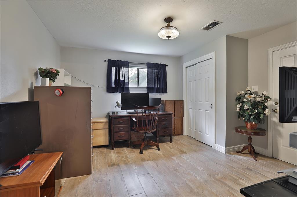 Fourth bedroom is quite large and has a door leading to the back patio area. Being used as an office currently.
