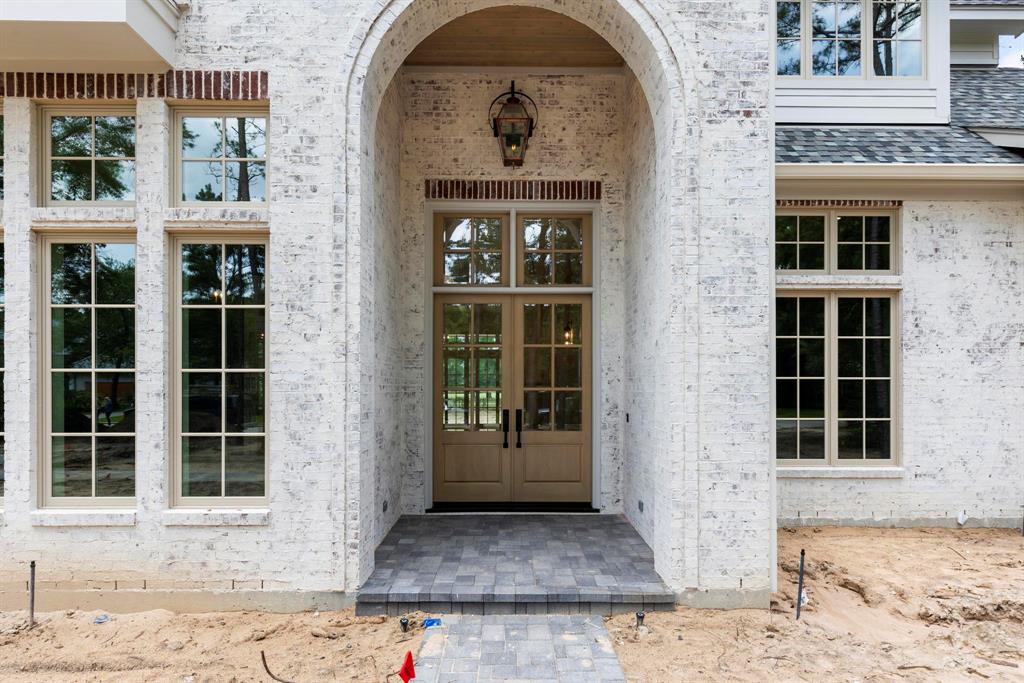 Designed for buyers that demand perfection in build, location and amenities. This is a one-of-a-kind opportunity to own a brand new, Mary Ross Custom Home located on just shy of an acre lot on the Palmer course fairway in the sought after Hollymead neighborhood of The Woodlands. A timeless open floorplan with and an abundance of natural light—including high beamed ceilings, immaculate millwork, and hand appointed designer finishes selected by Lehmann & Company throughout. This unique home, with its elevated finishes, is in its final phases of being completed—every room has been thoughtfully planned for today’s buyer’s lifestyle. Additional features include a backyard oasis with landscaping, pool and spa designed by BLV Enterprises, a wine room, exercise room, a second bedroom down, three ensuite bedrooms up, and a game room and bonus room created for the buyer’s choice of lifestyle in mind.