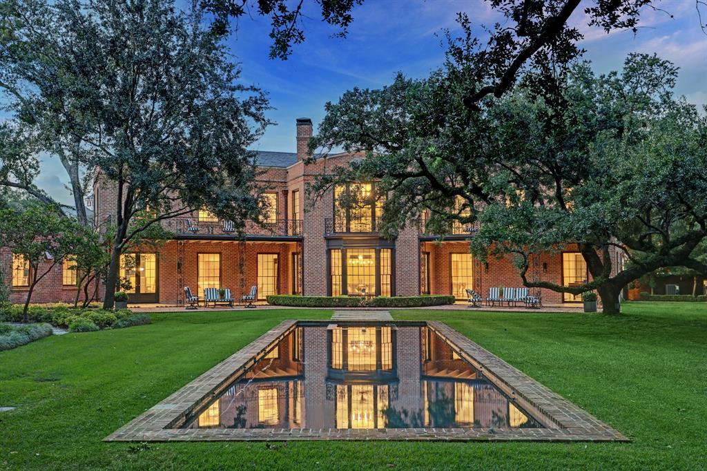 Legendary home listed on Nat’l Register of Historic Places. Built by John Staub for Margaret Wray, daughter of Texaco founder John Cullinan, later owned by Tx Gov Mark White. Classic architecture freshened & invigorated by owner’s renovation (2021) w/inspired contemporary design. Grand reception hall transitions to rear dining rm overlooking patios, gardens & lawn-dropped pool. One side wing includes main staircase, living rm, powder rm, & wine closet (1st-floor). Luxuriously reconfigured primary suite w/study, lavish dual bath & bespoke closet (2nd-floor). Opposite wing has great rm, walk-in full bar, gathering kitchen & breakfast rm, drop zone, rear staircase, gym/media rm & 2 half- baths (1st-floor), En suite bedrms w/ custom walk-in closets (2nd-floor). Kitchen/breakfast w/professional grade appliances & exposed original brick walls. Views from all primary rooms of ancient mossy oaks w/trailing branches, azalea beds, fountains, brick patios w/vintage ironwork & lovely pool.