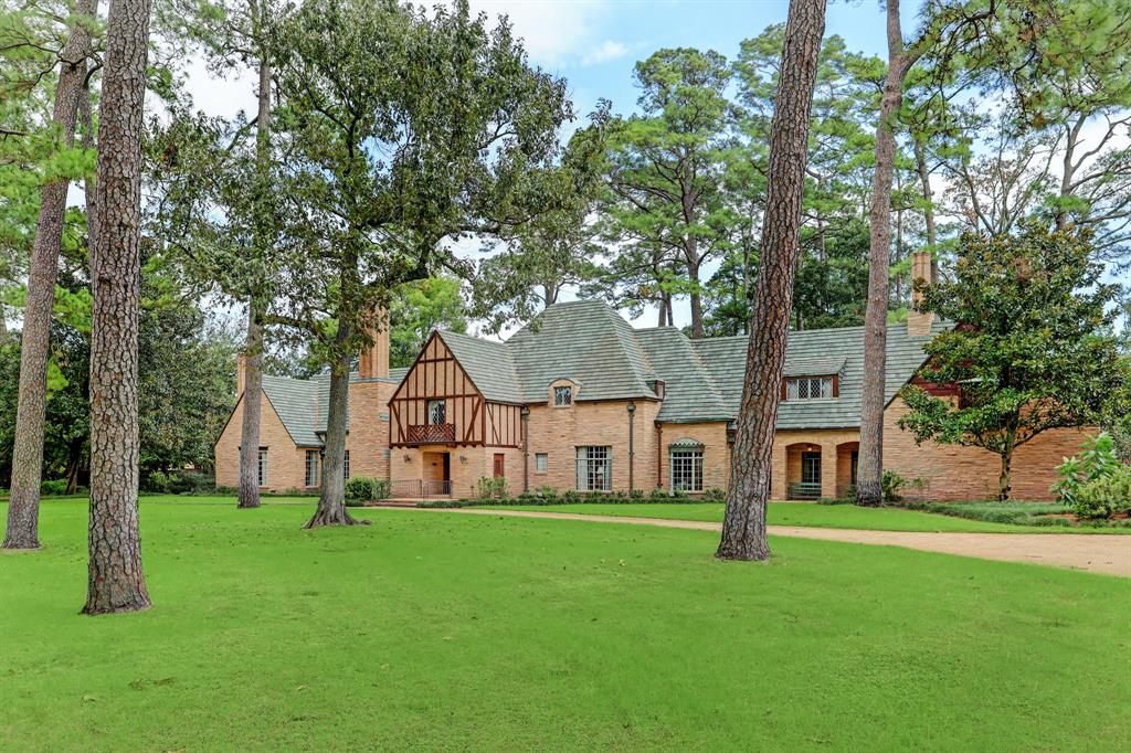 An enchanting River Oaks estate encompassing over 1.6+ acres in scale and showcasing a prominent placement with 340 ft. of frontage to Willowick Road (per HCAD) and the capability to be fully gated (subject to deed restrictions). This majestic manor designed by architecture firm Wirtz, Calhoun, & Trungate offers an exceptional floor plan enhanced by spectacular scale, substantial ceiling heights, and serene views from the steel and glass windows and doors opening to the surrounding park-like setting. Regal Reception Spaces. Paneled Library. Island Kitchen with Informal Dining Room. Sizable Den with wet bar. Primary Suite down with adjacent parlor and separate baths. Upstairs Game Room + Two Secondary Bedrooms, Home Office, and adjoining Quarters with alternate private entry. Two Staircases. Four Fireplaces with Antique Mantels. Slate Roof. A circular driveway leads to a gated motor court and two-car attached garage.