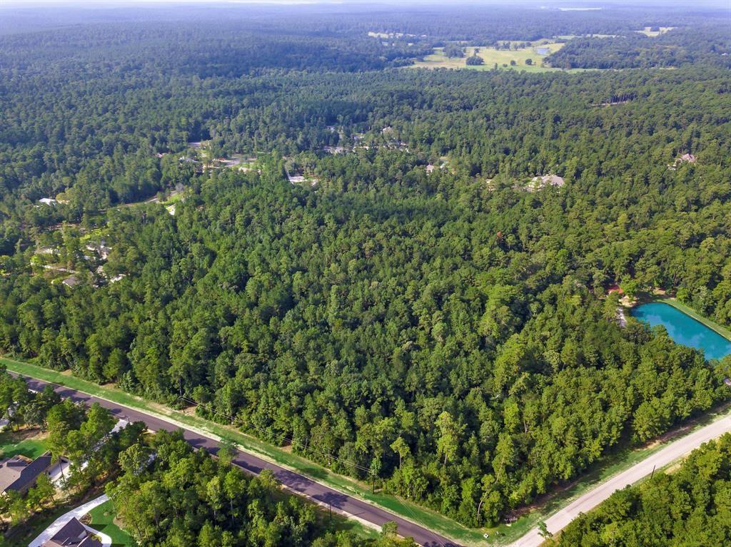 These lots back up to a beautiful 17 acre Community Park with pond, picnic pavilions, treehouses, playground and walking trails. Texas Grand Ranch is a large  wooded community. Rolling terrain, power, water, paved streets and fiber optic internet/phone. Start building whenever you want. Choose your own builder. You have to see Texas Grand Ranch to appreciate the rural setting, yet with custom homes and easy access to I-45.  Ranch lifestyle for your custom home.  Mature trees, covered pavilions, parks, ponds, playgrounds, BBQ areas. Minutes from shopping, dining, schools, hospitals, and entertainment. Low taxes - No MUD tax. HIGH & DRY - Average elevation is 325’ ASL. Surrounded by Nat’l Forest  & State Park with 100’s of miles of hiking, biking and horseback riding – boat launches & beaches.
