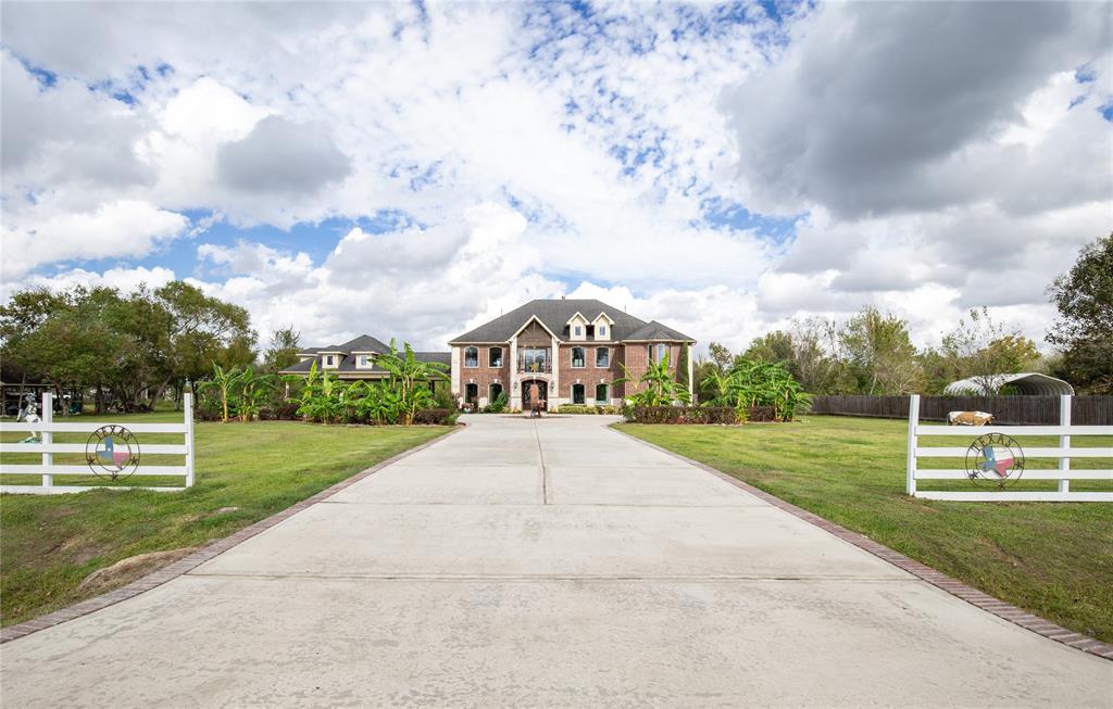Exquisite custom country living on 1.8262 acres in the heart of Pearland. The grand double curved staircase w/wrought iron and wood banister is the perfect entrance to WOW your guest. The beautiful trey ceiling with the entry chandelier adds to the ambiance.Tons of natural light.Formal dining w/custom built-ins. Beautiful tile flooring throughout the downstairs.Soaring 2 story stacked stone fireplace is focal point in the main family room w/custom built-ins & art niches.A fantastic kitchen for the chef of the house w/SS appliances, gas cooktop, built-in oven & microwave.Custom built cabinetry, wine rack, granite counters & tile backsplash. Humongous primary suite w/sitting area & private patio access. Primary bath features double walk-in custom closets with built-ins which offer tons of storage, large walk-in shower, jacuzzi tub. First floor office.Fantastic upstairs gameroom & living area.Media room.Multiple balconies.Tons of storage. Fabulous location.Great for entertaining.