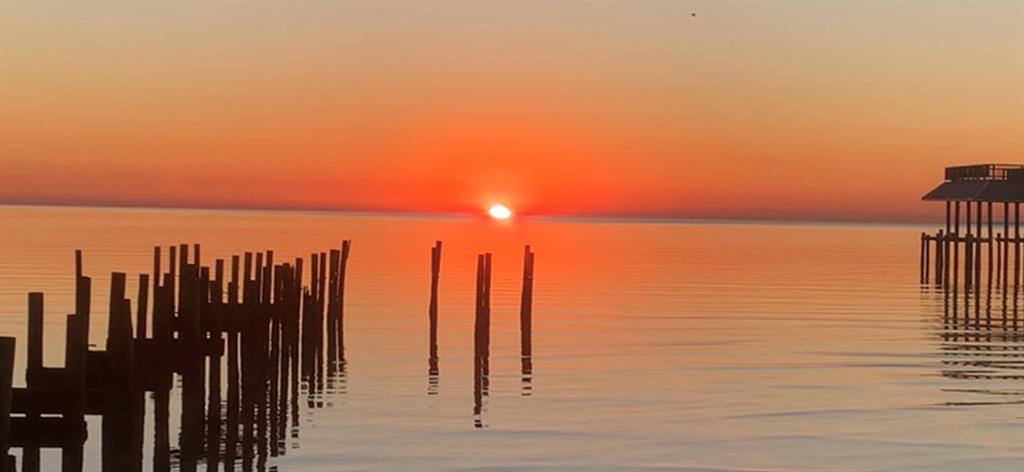 Enjoy the beautiful sunrise from this waterfront lot.