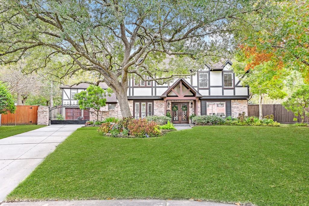 This English Tudor luxury home nestled on a cul-de-sac has it all, location, craftsmanship & exquisite details throughout. Built for entertaining, this home highlights butted glass windows, travertine & pine wood flooring, stone accent walls, and iron scrollwork. An abundance of natural light connects the family room & kitchen, making this home bright & inviting. Outfitted w/ state of the art high-end appliances, custom pine cabinetry, and spacious granite counter space creating the ideal chef’s gourmet kitchen. Premium features include; ice-maker, wine fridge, whole house generator along w/ guesthouse, huge game-room space, & kitchenette. Outdoor pavilion features wood plank ceiling, kitchen, which opens to the resort style heated pool/spa waterfall details located near the private sports court w/ stadium lighting.Take delight in the landscaping surrounded w/ mosquito misting system, gated driveway, security camera, and sprinkler system. The custom finishes make this home a must-see.
