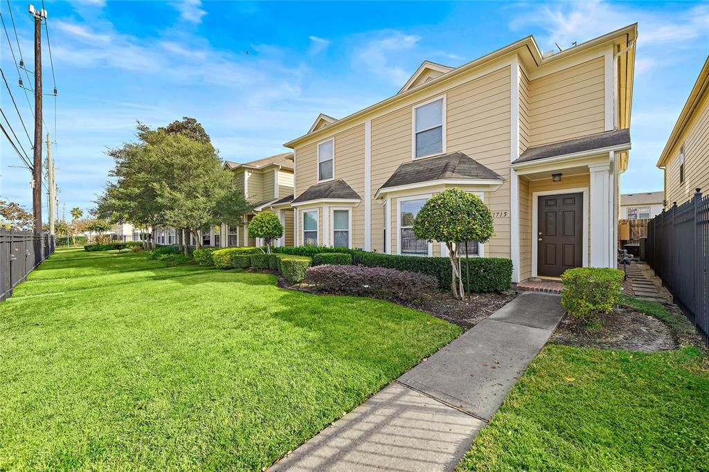 Your new home with a fully fenced front lawn and gated front entry.