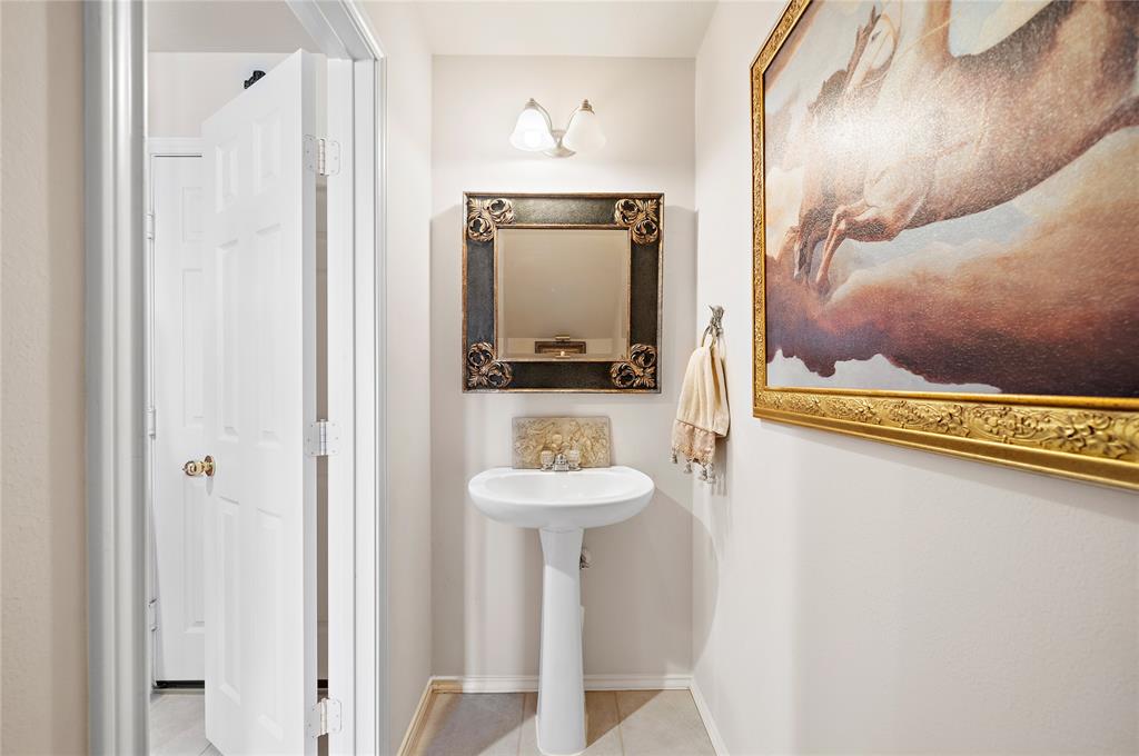 Generous sized powder room off of the living area, perfect for guests.
