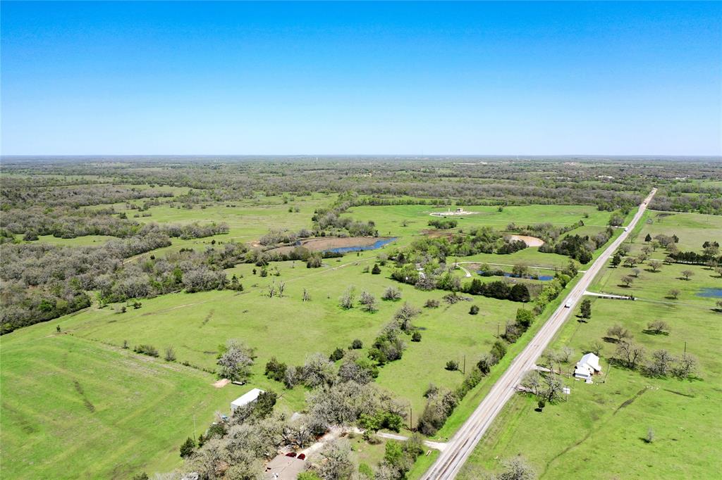 Cattle, Recreational, Hunting you decide!! Multiple homesite opportunities. Quiet and secluded with numerous build sites and gorgeous views. 150 acres of pasture. Incredible grazing acres, mature oak trees. Improved pastures for both horses and cattle while also providing plenty of potential for hunting and relaxing. Plenty of cover and water for wildlife. The natural terrain is tranquil while offering possibilities to make it your own. Ideal for full-time living ranch or family weekend/seasonal hunting, recreational ranch, or cattle-hay production. Caney Creek provides generous cover and water for an abundance of wildlife. Give The Wells Team a call today!! INVESTORS- this one is worth a good look and could be easily subdivided! 5100ft of HWY 90 and only 3 miles to town.