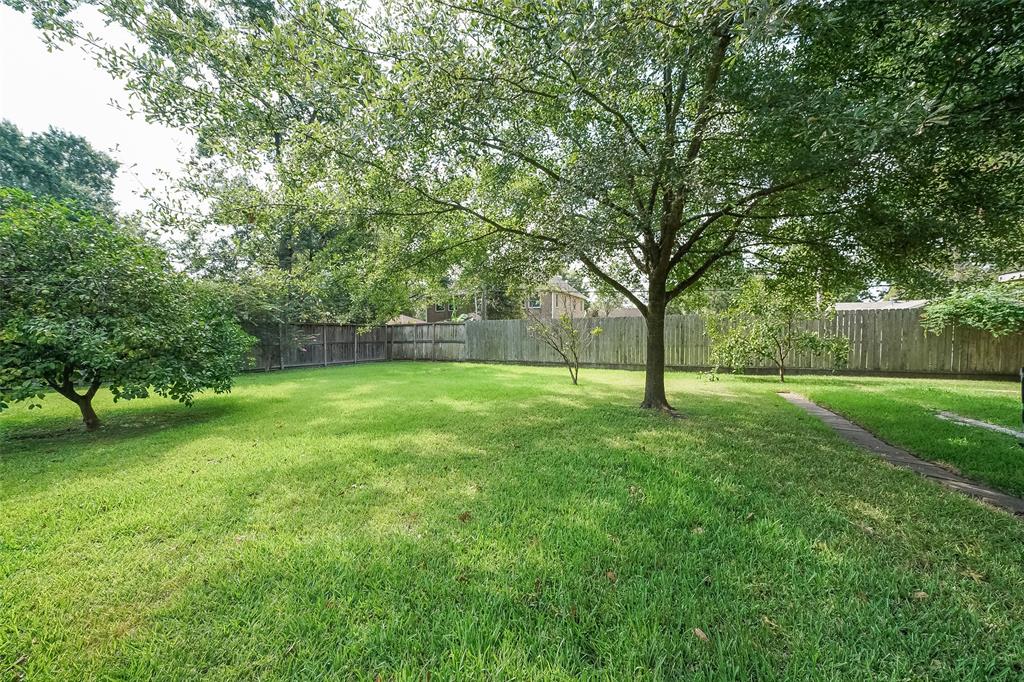The over-sized lot has a large back yard which is perfect for BBQs and family fun.