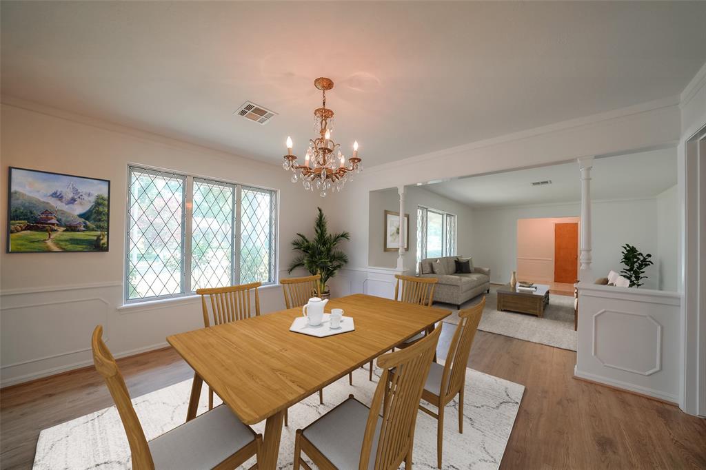 The large formal dining room can easily fit a six or eight person dining table. This photo has been virtually staged.