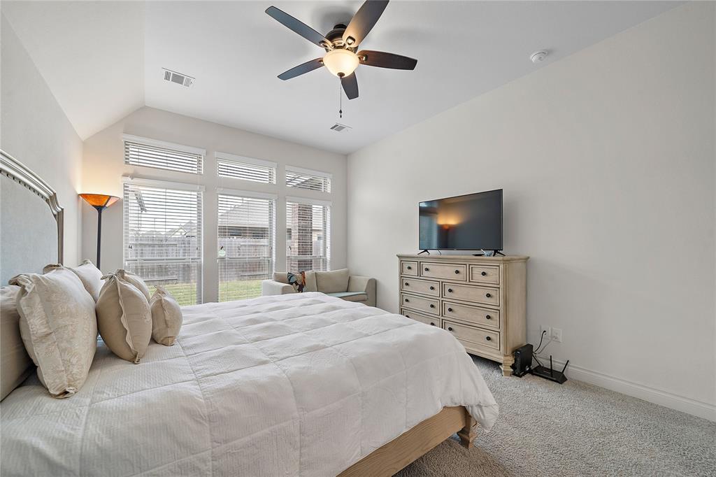 Primary bedroom overlooking the backyard with ample privacy from neighbors.