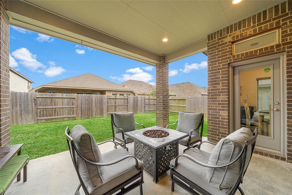Extended covered back patio perfect for entertaining and relaxing all 8 months of the Houston summer!!!