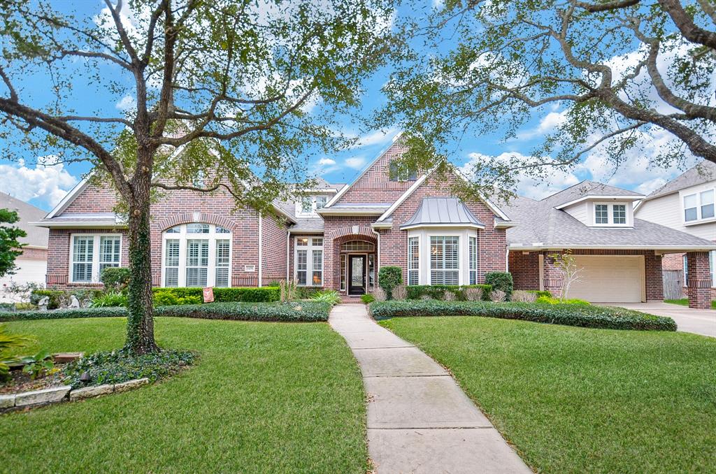 NESTLED within one of Katy's finest communities, GRAYSON LAKES, you will discover a very highly sought-after, 1-STORY, situated on almost 1/2 ACRE premium lot (NO BACK NEIGHBORS). This picturesque home will surely check all the boxes on your list offering 4BR/4BA, 4 car garage, GAME ROOM/FLEX ROOM, open concept, sunlit kitchen/family room all built by DAVID WEEKLEY! Escape to your own private backyard oasis with massive decking for entertaining, pool, covered patio, space for outdoor kitchen, all backing up to about a 40' easement, which provides you additional space & privacy. As you arrive you will adore the mature trees, beautiful landscape & landscape lighting that greet you. The details are abundant...double crown moulding, exposed brick arches, high ceilings, wood/tile throughout (NO CARPET), each bedroom with access to their own bathroom, study nook...and MORE! Escape from everyday city life & enjoy Texas charm right here!Once you see it, you'll want to call it home!NO FLOODING!