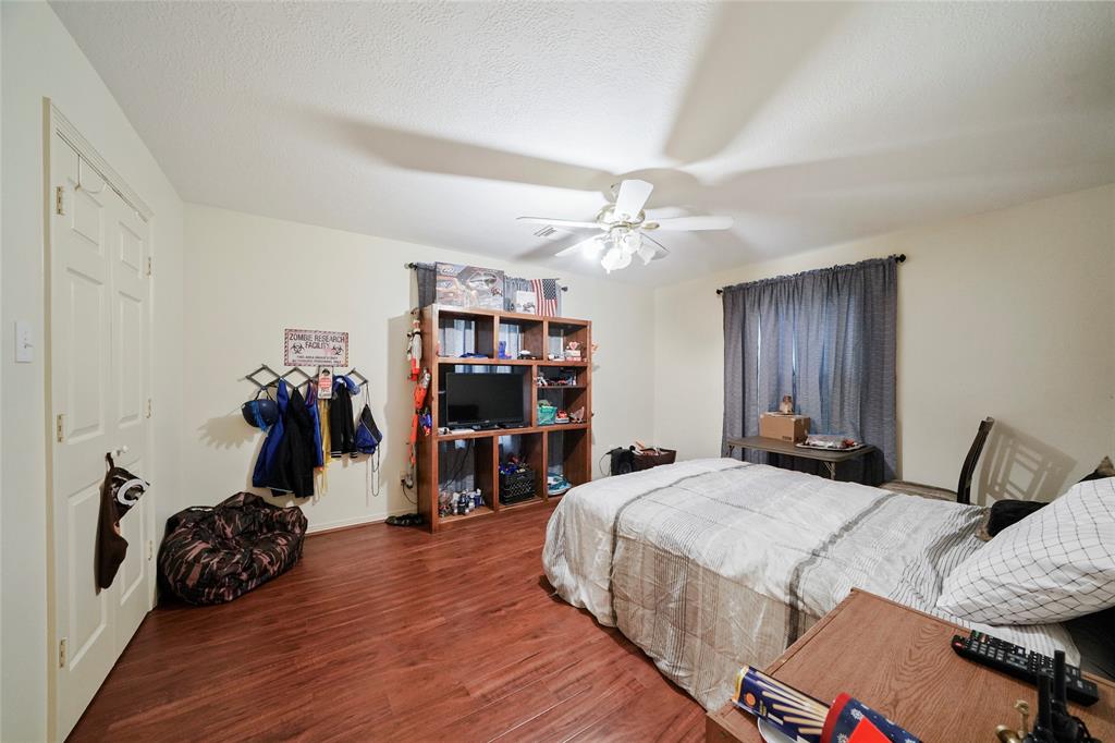 Large secondary bedroom with updated flooring.