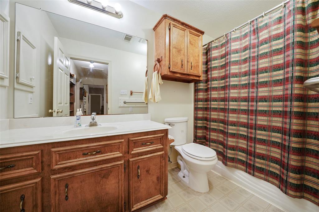 Guest bathroom is located just of the secondary bedrooms.