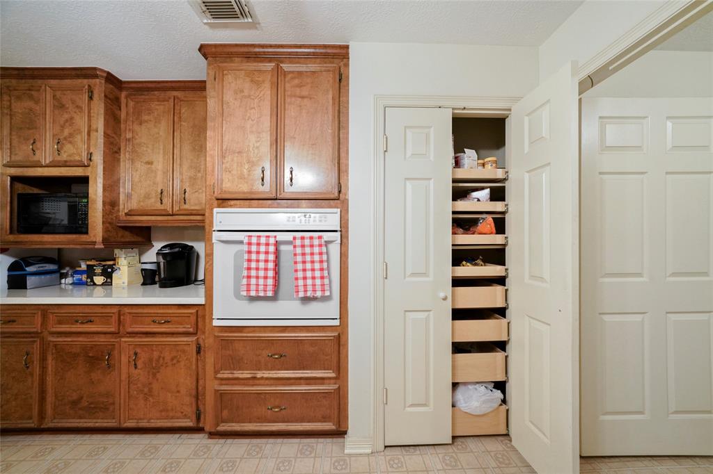 Tons of storage included in the kitchen, including this reach in pantry.