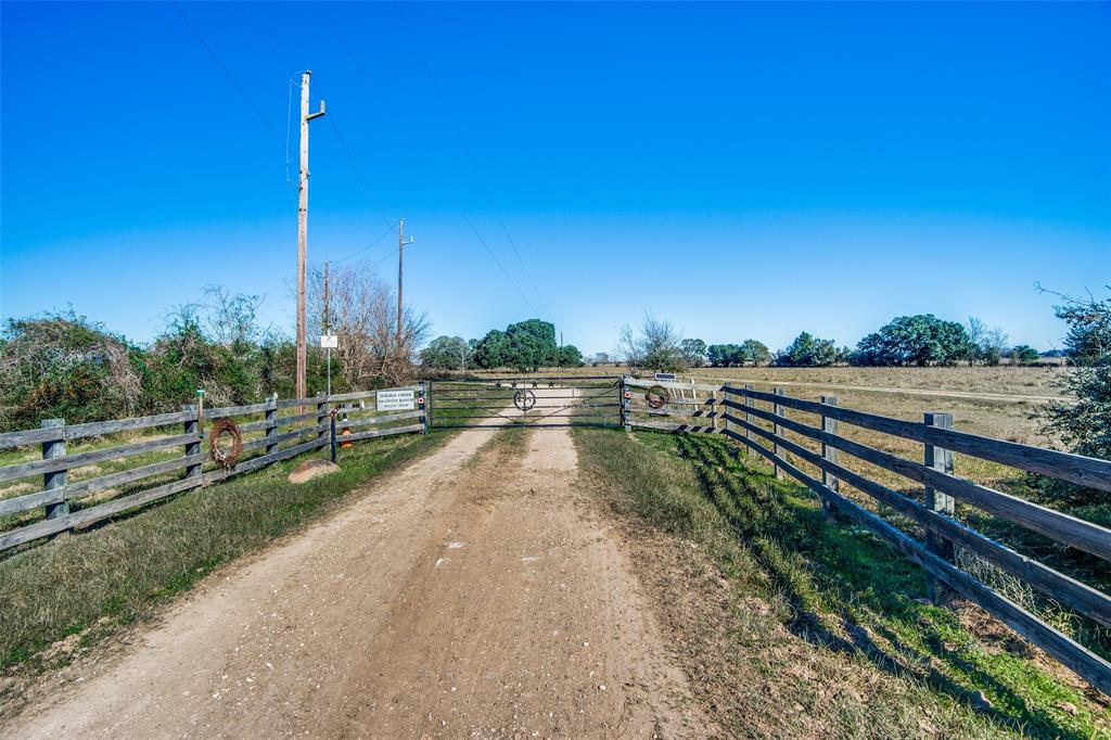 Are you craving a tranquil country lifestyle where you’ll feel a million miles away from the stresses of everyday life? Perhaps you’re an investor looking to expand your real estate portfolio. If so, check out this amazing chance to own 150 acres of Austin County farm/ranch land less than ten miles from the Brazos River in Wallis, Texas. Conveniently located just a short drive from Highway 36, it has utilities on site and includes a pond, and multiple outbuildings. Mature oak and pecan trees are scattered throughout the property.
Ready to get back to basics and start enjoying rural life? If farming or ranching is something you’ve always wanted to do, here’s your chance to reach your goal. Or, if you’re already working the land and just want or need more acreage, this may be the ideal way for you to grow your operation. No matter what your motivation, be sure to take advantage of this fantastic opportunity and come take a tour to experience the many possibilities that await you!
