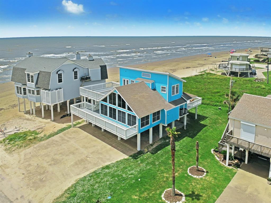 This quintessential Pirates Beach home is located just one house from the beach with show stopping ocean views and multiple entertaining decks. Inside you are greeted with an open floorplan, 2-story living and dining room and kitchen with ample breakfast bar seating. The 4 bedroom two-bathroom home is designed with 2 bedrooms and one bath on the main level and 2 bedrooms and 1 bath on the top floor. Laundry is located on the main level. Under the home is a large storage room for all your beach essentials!
