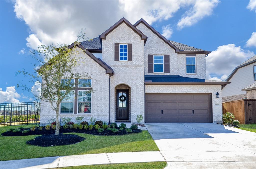 Coldwell Banker Realty is proud to present this beautiful 2021 David Weekley Home located on a lake lot on a cul-de-sac in the master-planned community of Cane Island. This home sits on a 7,884 square foot lot with a brick and stone façade and a 2 car garage. A true 4BR/3 bath home, this home features a primary and secondary Mother In Law suite located on the 1st Floor! Beautiful upgraded SPC floors throughout downstairs except bedrooms, upgraded staircase and landing, upgraded 8' front door and upgraded white mortar.  Kitchen features many upgrades to include beautiful cabinets, quartz countertops, Frigidaire Gallery SS appliances to include a 36" cooktop, large island, beautiful upgraded pendent lighting and plenty of storage! Outside the home showcases a beautiful lake view from your covered patio, full yard sprinkler system, and beautiful landscaping.  Zoned to the outstanding school district of KISD with Cane Island's onsite Elementary set to open in August of 2022!