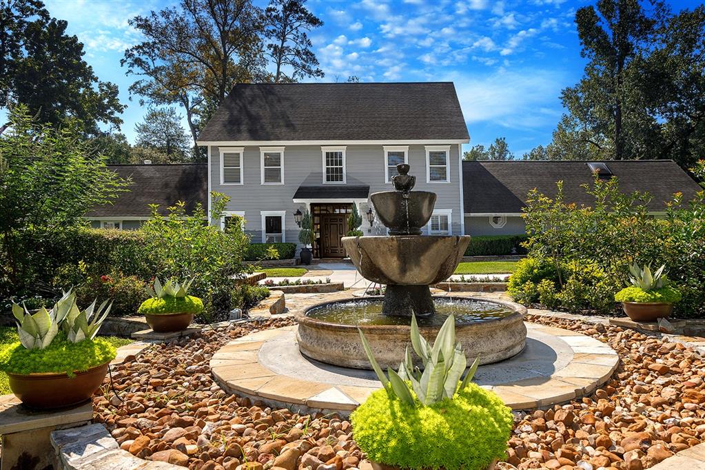 Beautiful front grounds with fountain.