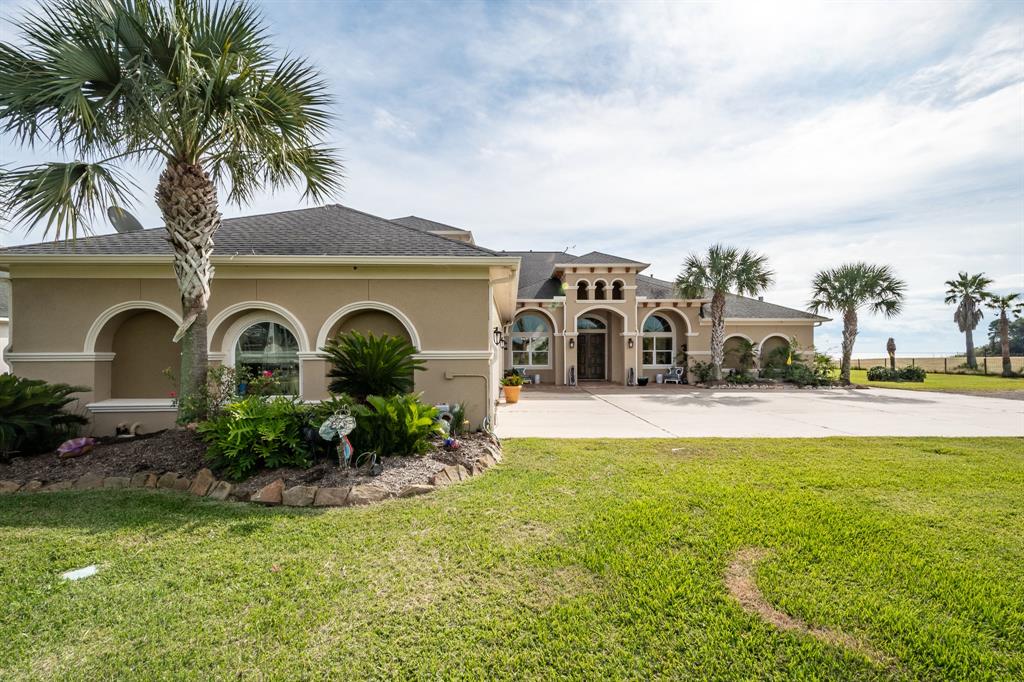 One of a kind Home on 15.29 acres with the Best View of Trinity Bay and Redfish reef. Fish in the Bay or the 2 stocked ponds on property. approx 621' of Waterfront. ICF Built House with 12" walls. Enjoy your Star Gazing and the most gorgeous Sunrises. The Gourmet Kitchen has a recent Thermador gas cook top, KitchenAid signature appliances, warming drawers, under counter ice machine, pot filler. Gorgeous covered saltillo tiled patio with an outdoor kitchen for entertaining near the pool. Custom heated pool, Hot Tub, 3 Fountains. Gas log Fire pit, outdoor weather proof TV, 110' projection TV  Black Diamond Screen.  The four Car Garage has a Tesla Car Charger. 4 AC units,  Generac Generator, irrigation and drainage systems. Savant control system.  Surround sound.  Whole house vac, Elevator.   Hurricane Screen.   Mosquito Misting System. 2 MotorHome hook up stations.5,000 sf Metal Building for the big toys. Room Sizes are approximate .See attached information sheet with numerous amenities.