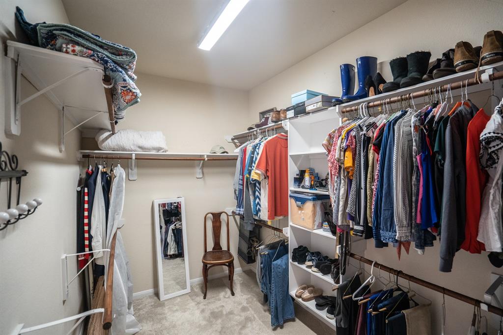Large walk in primary closet in addition to a linen closet.