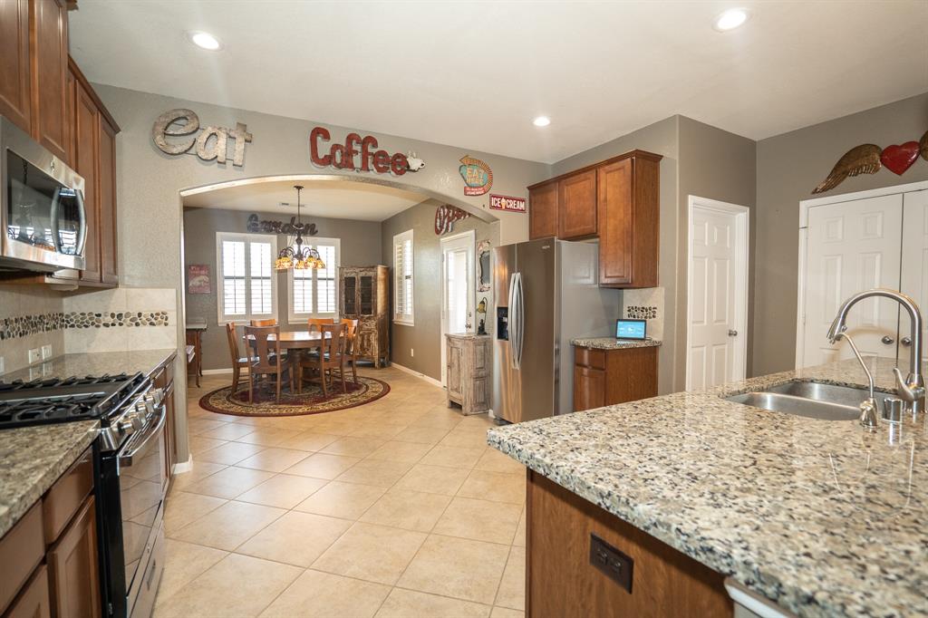 Views of the kitchen with so much counter space and storage, including a large pantry.