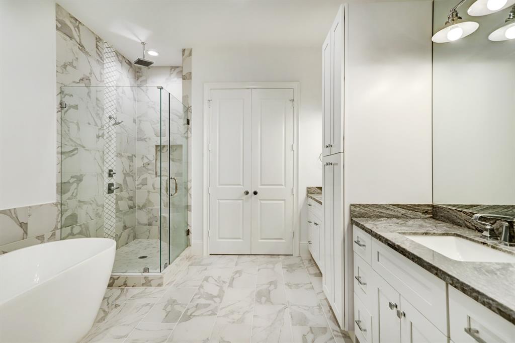 This lovely bathroom will appeal to different people for different reasons. The soaking tub, a roomy (separate shower) and all the gleaming surfaces are all good choices.