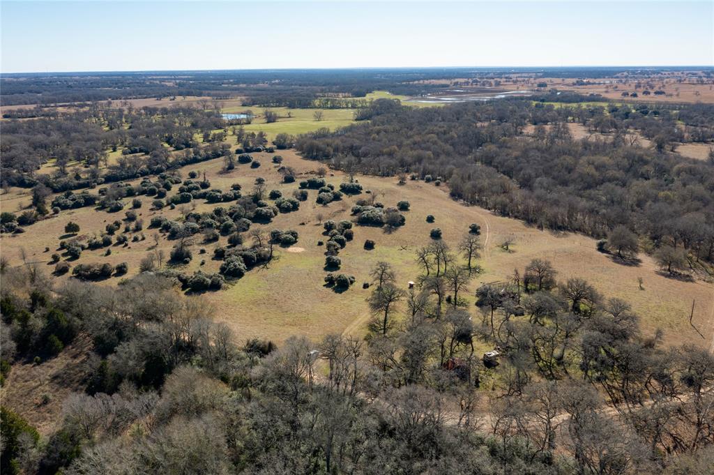 TBD County Road 324 Caldwell, Texas This unique 84 +/- acreage property with a current agricultural exemption combines privacy, ample recreational and hunting opportunities as well as grazing for livestock. Build your dream home or weekend cottage on the north side of the property with scattered trees or simply pull in an RV and hook up to the existing electrical access. The sprawling meadows of native grass, ancient oak trees, and the seasonal East Yegua Creek provide habit for abundant wildlife, while the working pens and chute make it easy to handle any livestock needs. Surrounded by large acreage estates and located on a cul-de-sac at the end of County Road 324, this property feels peaceful and secluded with quick access to the surrounding communities.