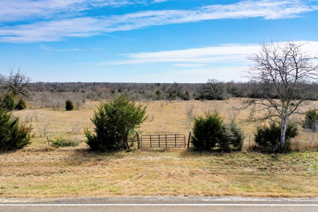 85.53 +/- Acres of Madison County Mixed-use Property off of asphalt farm to market road frontage offers the opportunity to get away in a great centralized location. Featuring large fields with scattered woods primarily in the back of the property and a pond close to the front. This tract has abundant evidence of wildlife and is approximately 25-30% wooded. There is an agriculture exemption already in place. Many possibilities with this property to either build your dream home, use recreationally or farm and ranch. Located about 10 minutes from Madisonville, 10 minutes from I-45 between Houston and Dallas, 30 minutes from Crockett and an hour from Bryan/College Station.