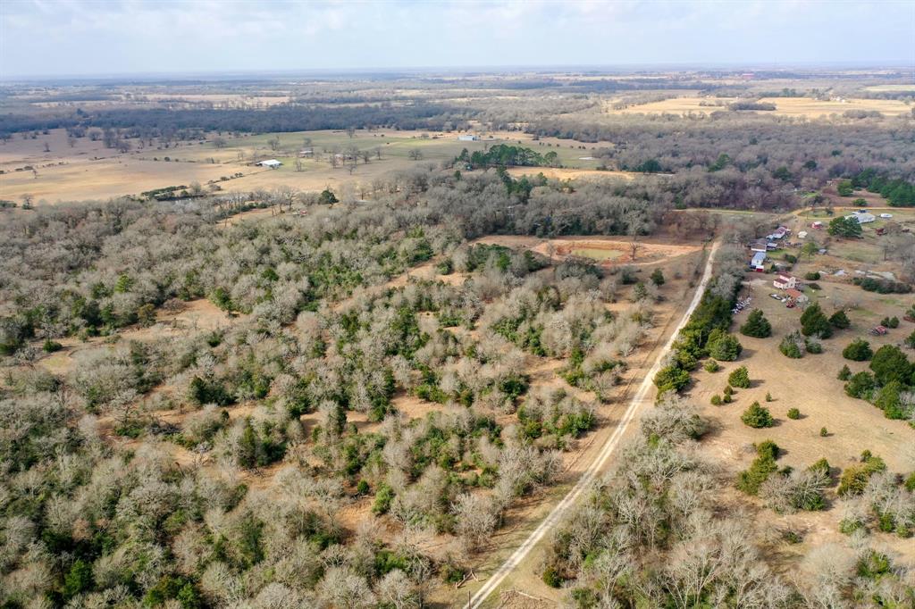 Unrestricted 13.23/- acre tract sits off of Hwy 75 in Northern Madison County, approximately 10 minutes north of Madisonville and just minutes away from I-45 access. This tract presents approximately 20% open/ 80% wooded, has a nice mix of hard and softwoods, and some underbrush for wildlife covering.  Other features include approximately 1391' of road frontage, a pond, perimeter fence, an old barn, and access to nearby electricity.  So many opportunities for this property; make it your single-family homestead, a multifamily property, or weekend retreat.