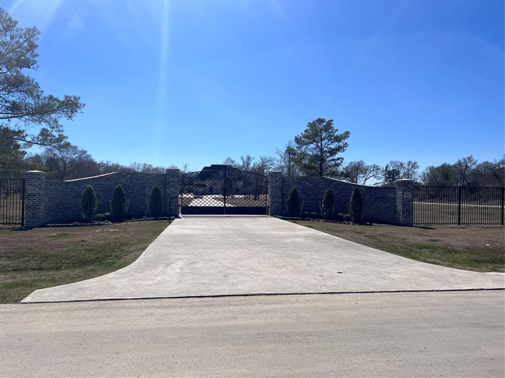 Beautiful, luxury estate situated in Winfree Oaks Subdivision.  This 5 bedroom, 5 full and 3 half bath, 4 car garage will check all your boxes.  This home also includes a study, media room, formal dining, separate office, and a massive utility room. Outside is a large shop and resort style pool.