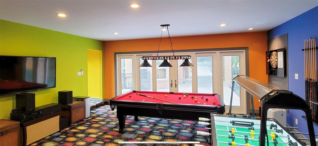 This room is perfect for entertaining or could be converted back into a garage space.