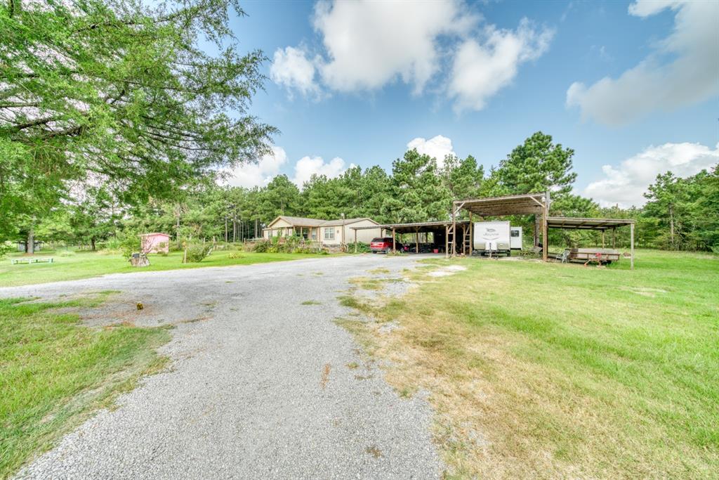 Come view this unique 5.5 +- acre unrestricted property today. Property includes a well maintained double-wide manufactured home, 3-car carport plus additional covered parking and electrical hook-up for a camper, perimeter fencing, cross fencing, and approximately 1,000 sq. ft. shop. All dimensions should be verified by prospective buyer(s).